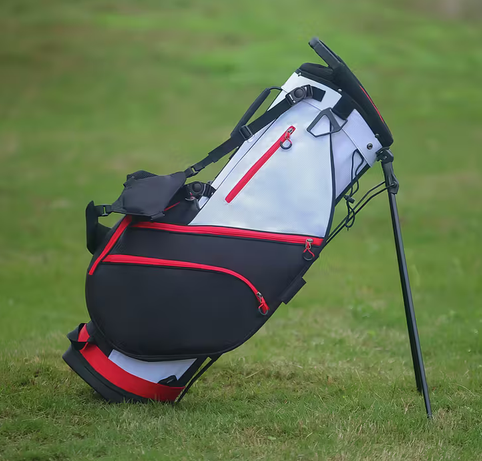PEGG Pro Stand Golf Bag – Black/Red/White colourway on golf course grass